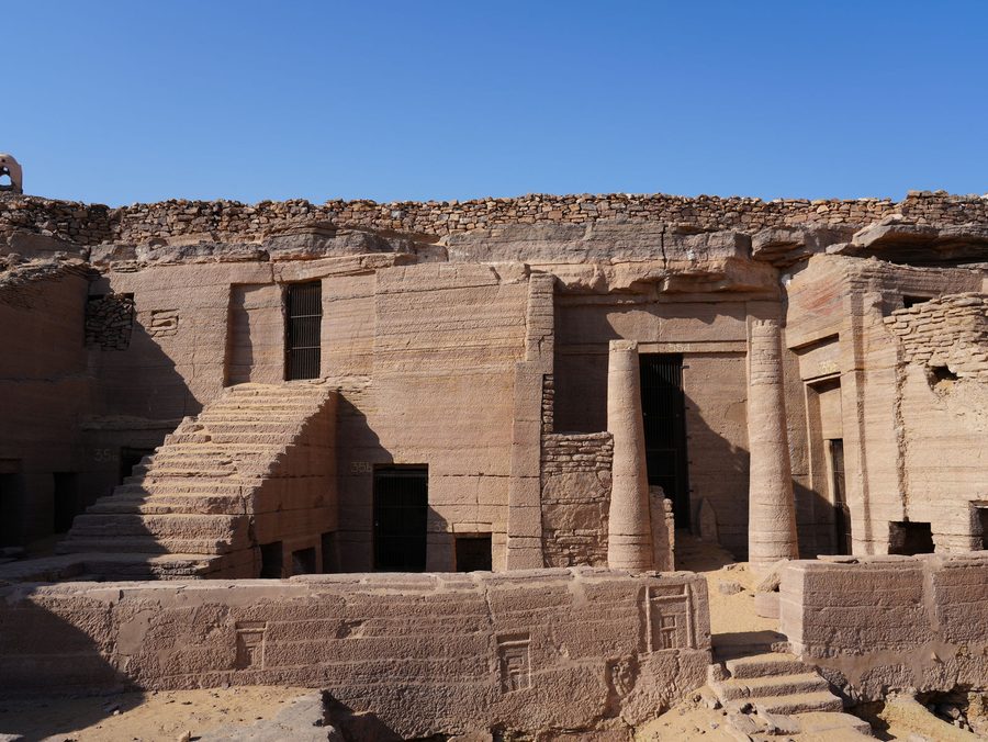 The grand rock-cut entrance pillars of the historic Tombs of the Nobles