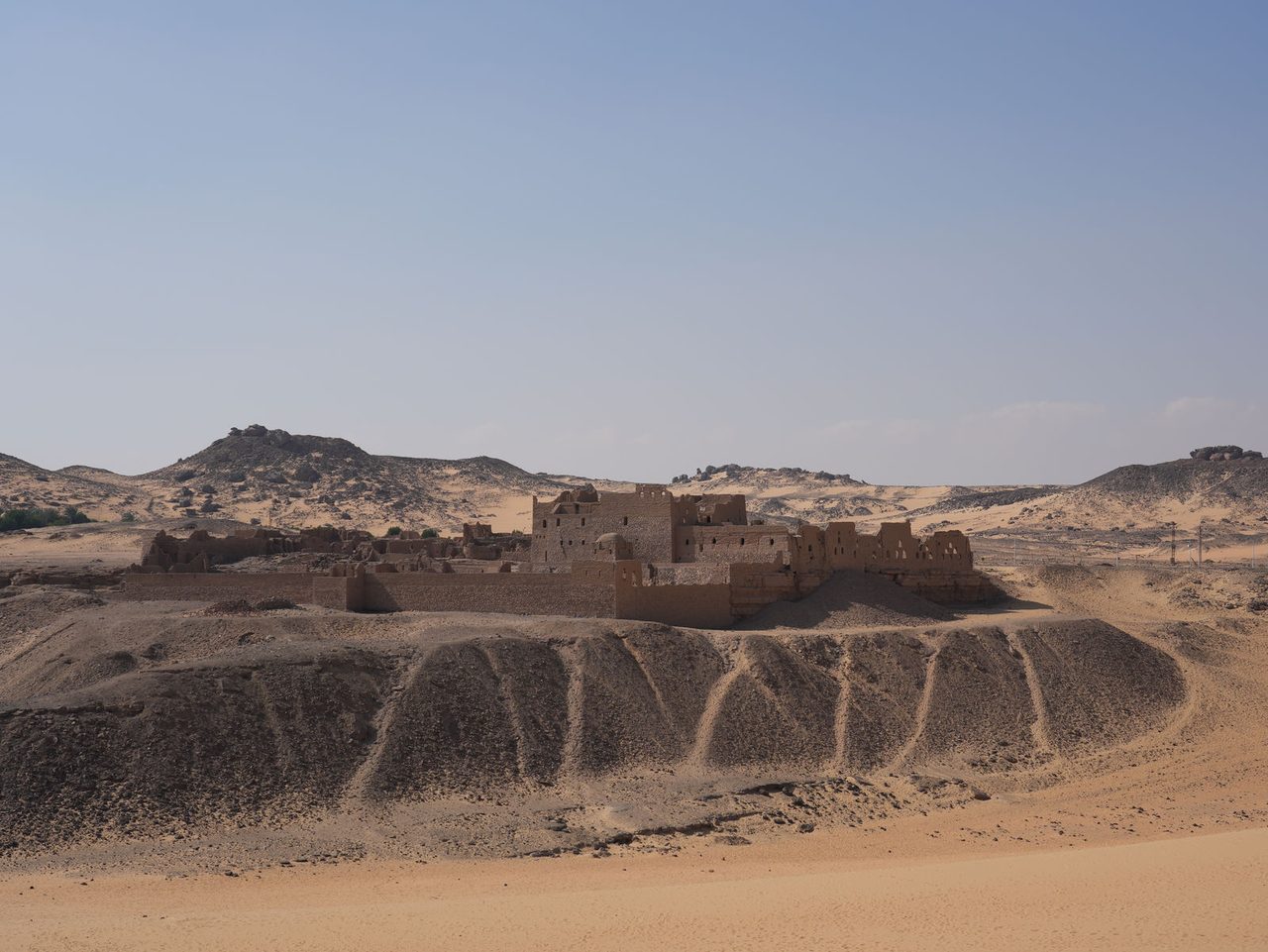 The historic Monastery of St. Simeon standing isolated in the vast desert