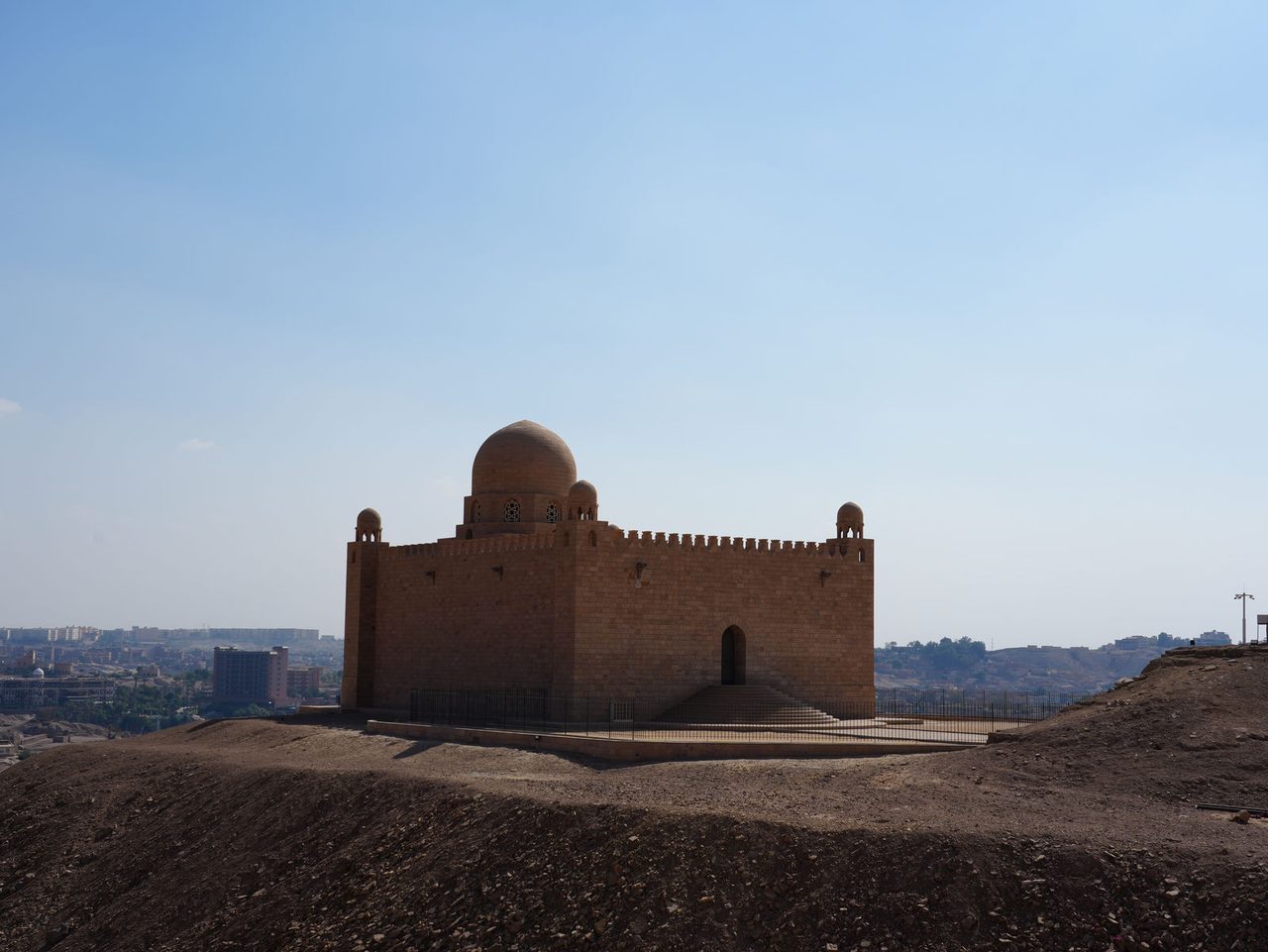 The grand and peaceful silhouette of the Aga Khan Mausoleum on the hill