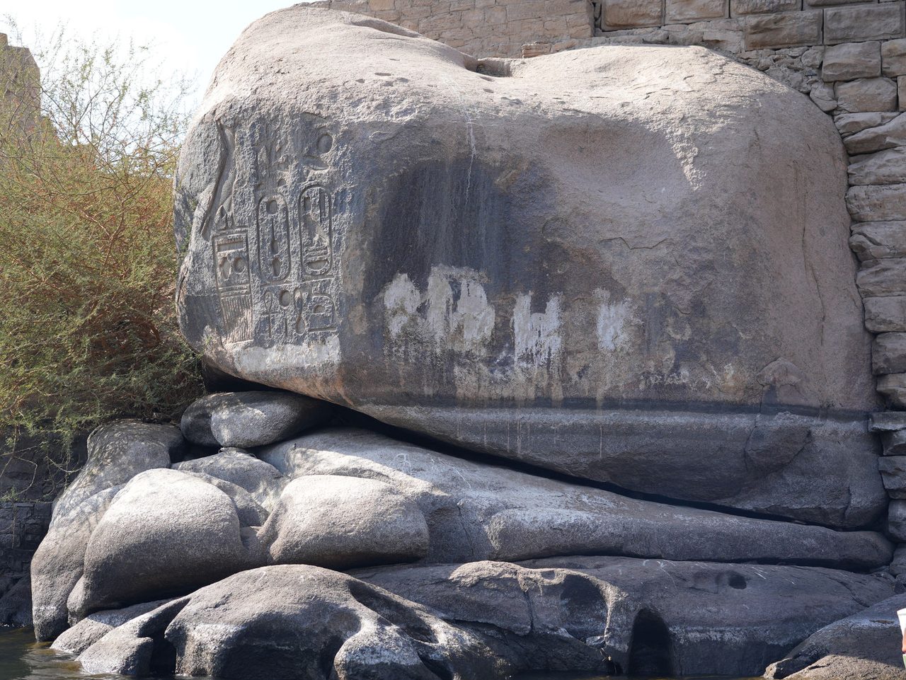 Ancient pharaonic cartouches carved into the massive river stones