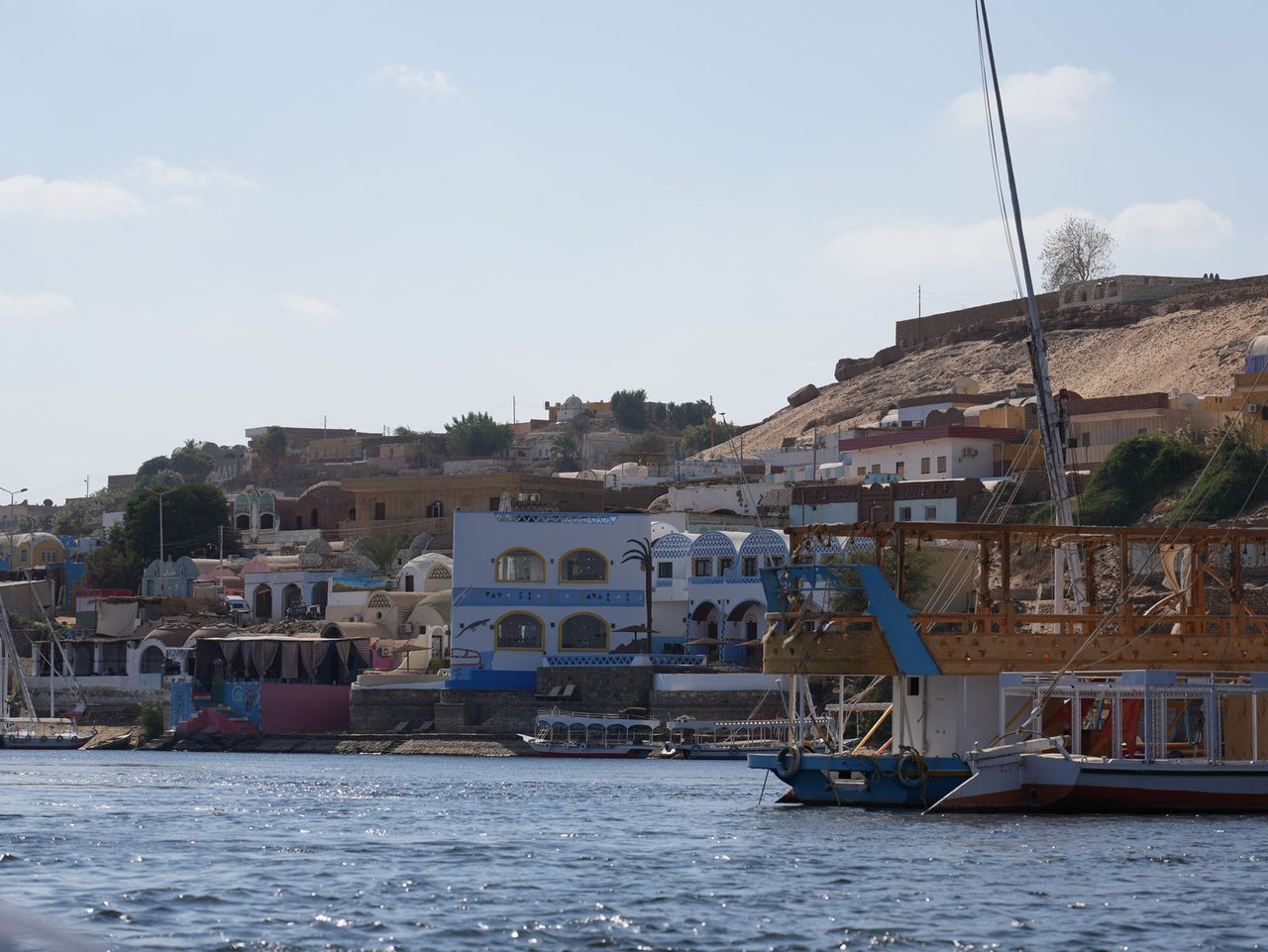 Sailing past the vibrant and colorful houses of a Nubian Village