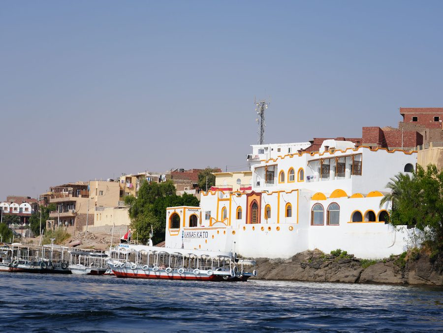 The vibrant white and orange houses of Anas Kato along the Nile River
