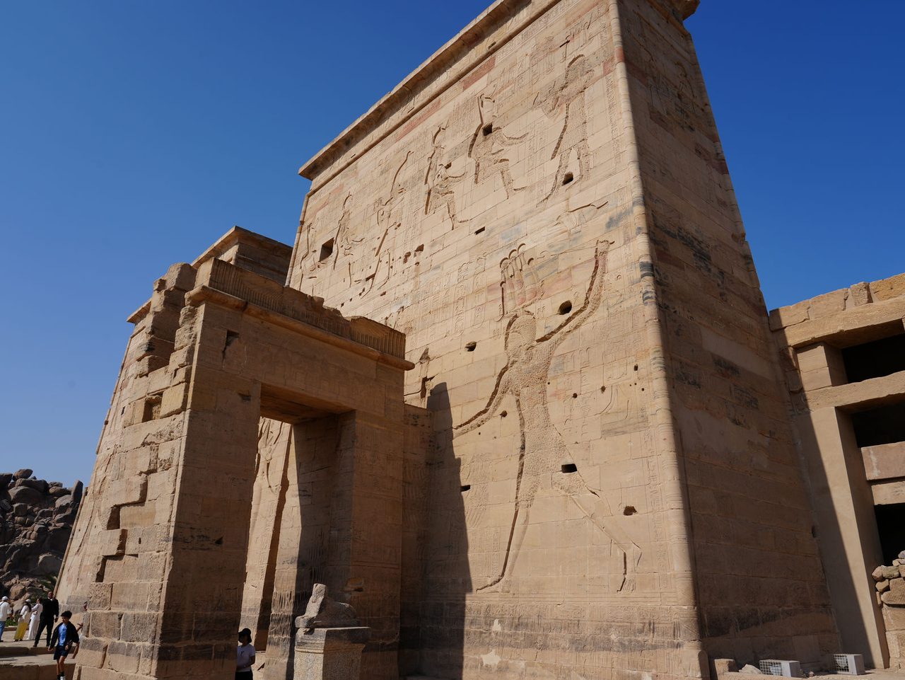Looking up at the majestic carved reliefs of Philae Temple