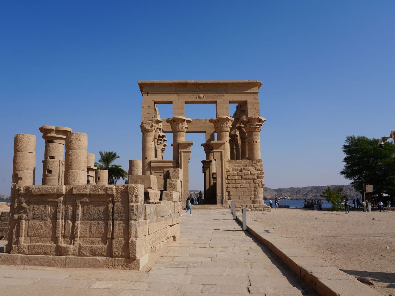 The elegant stone columns of Trajan's Kiosk standing under a blue sky