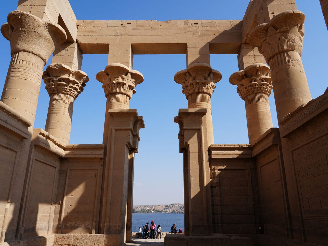 The stunning stone pillars of Trajan's Kiosk framing the Nile River