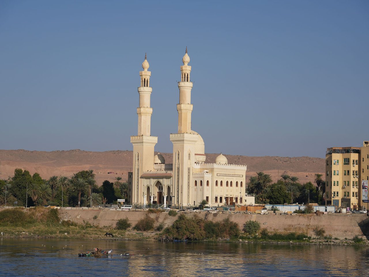 The magnificent twin minarets of the historic El-Tabia Mosque rising above the Nile