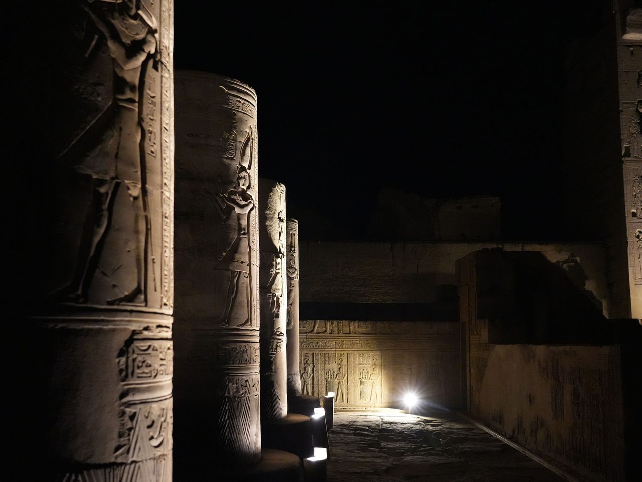 Mystical light and shadows dancing on the sacred pillars of Kom Ombo