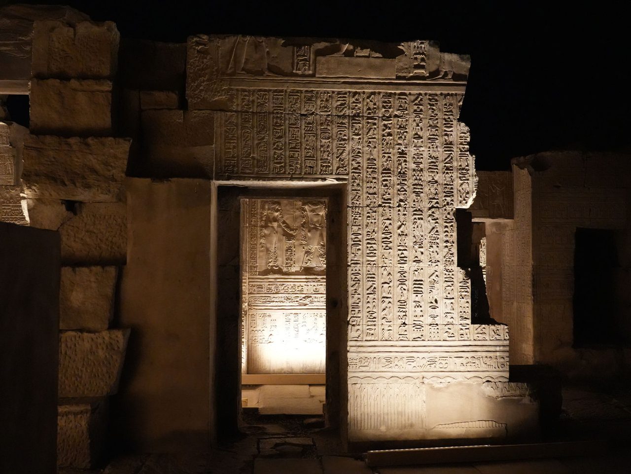 Looking through a mystical stone gateway inside the Temple of Kom Ombo