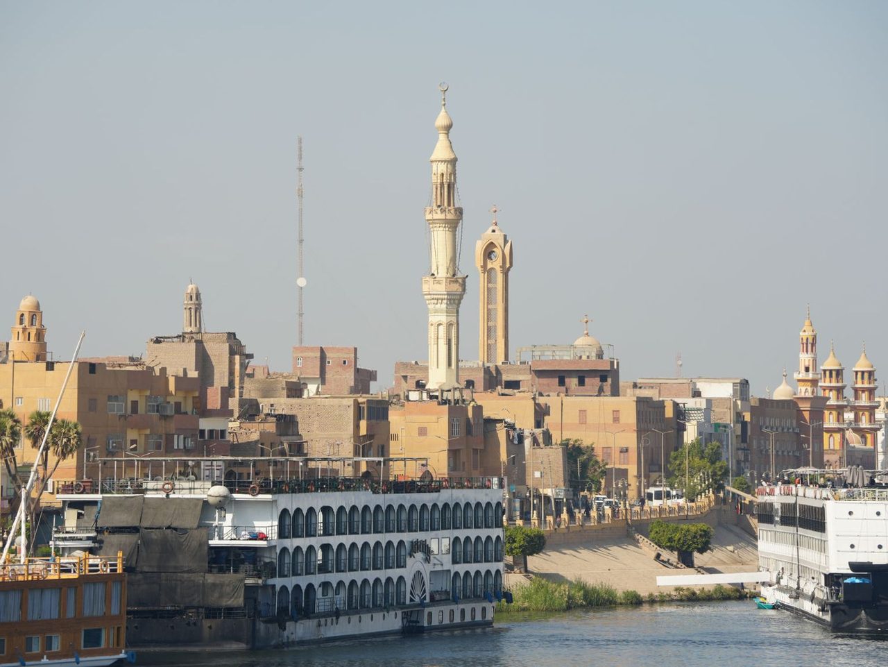 The stunning skyline of a historic riverside town along the Nile River