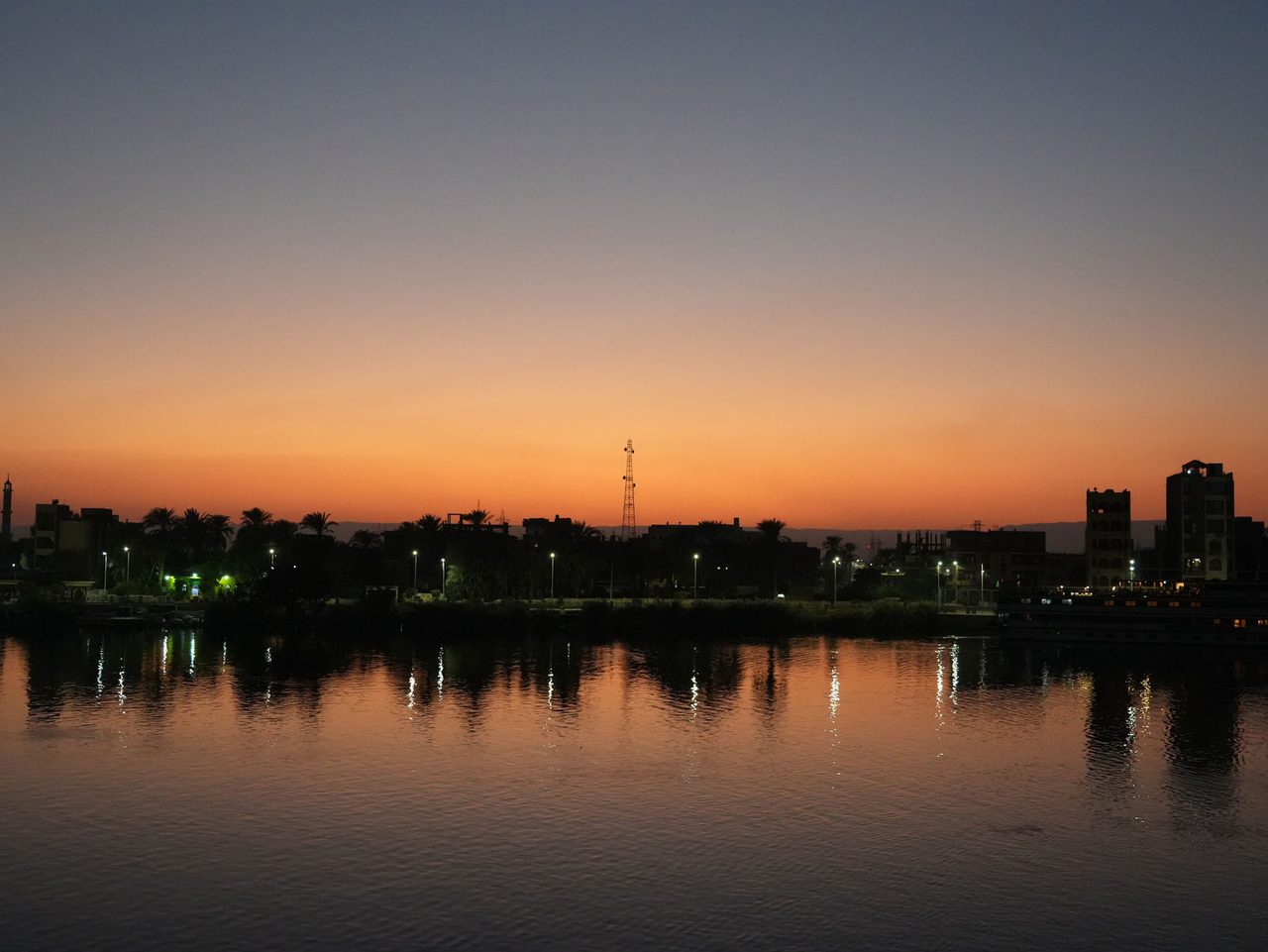 A perfect twilight gradient casting golden reflections over the Nile River