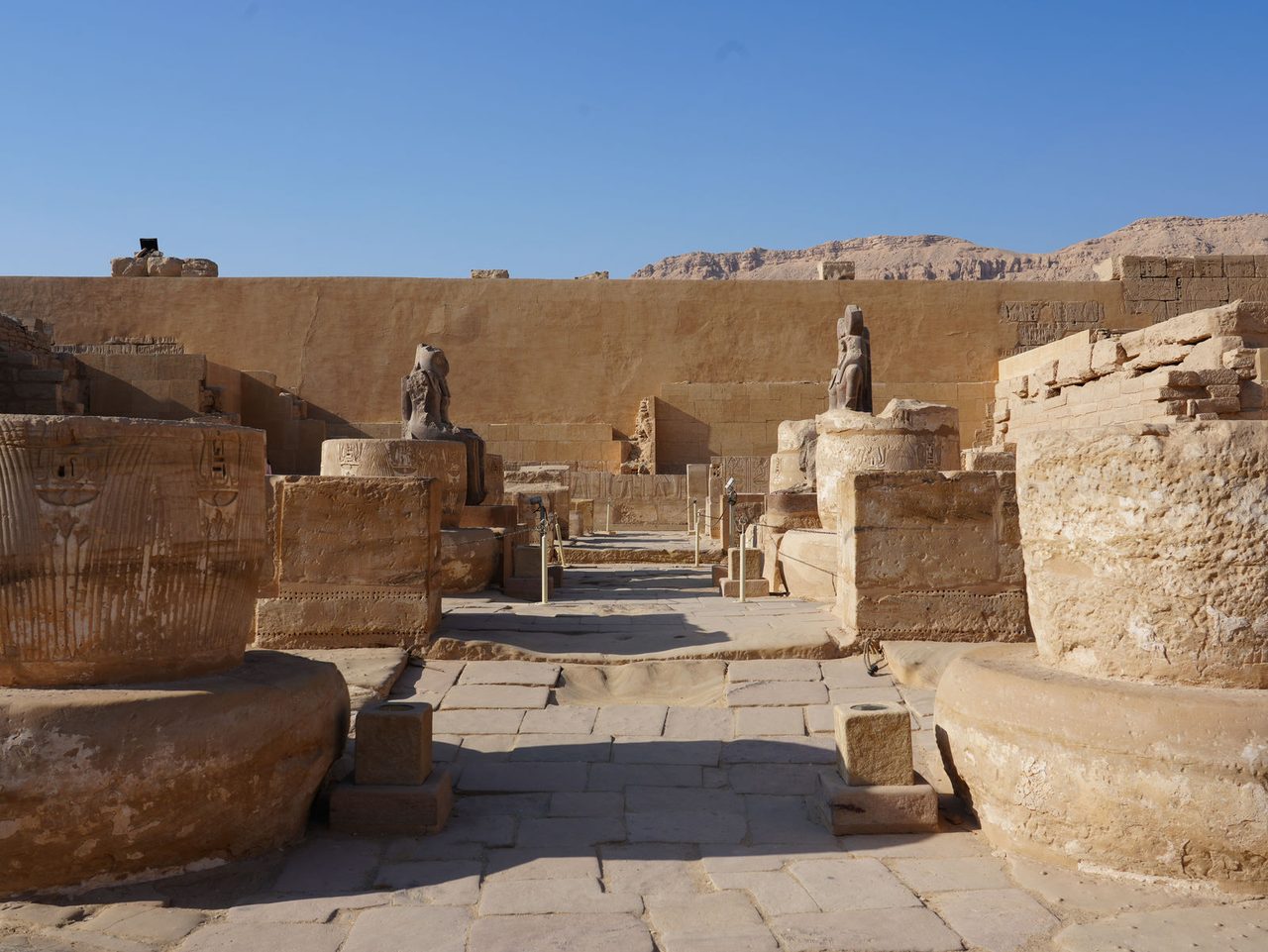 The hypostyle hall ruins and broken columns at Medinet Habu