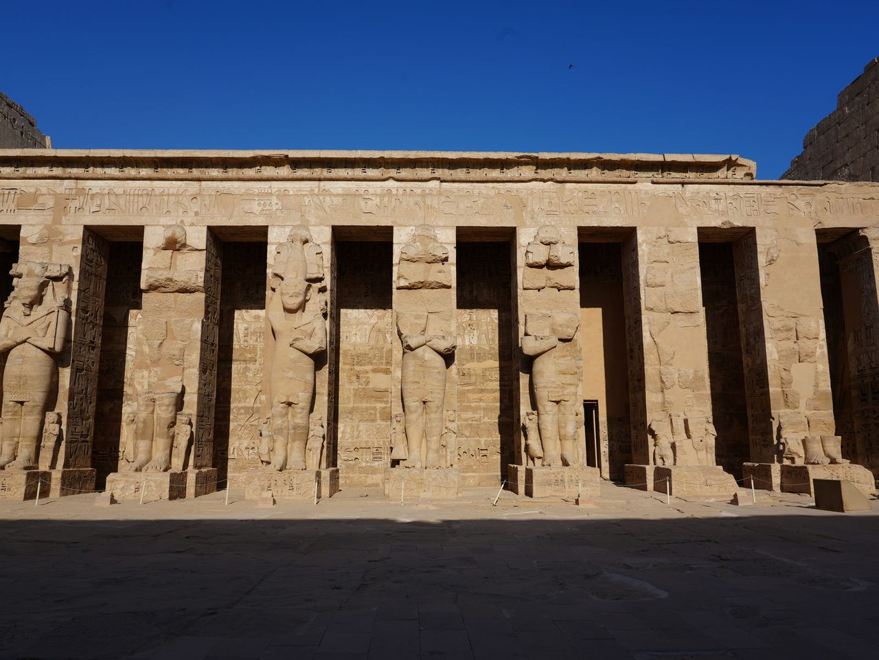 The Osiride pillars of Ramesses III in the second courtyard at Medinet Habu