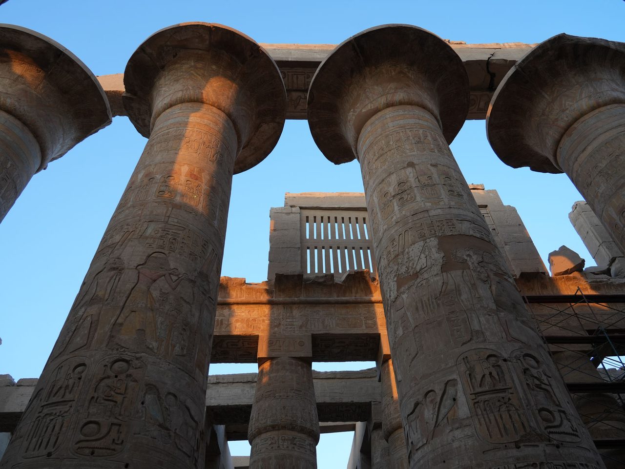 The towering open papyrus columns of the Great Hypostyle Hall at Karnak Temple