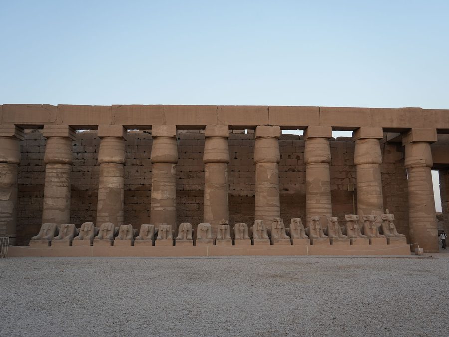 The row of criosphinxes and the grand colonnade inside the first courtyard of Karnak Temple