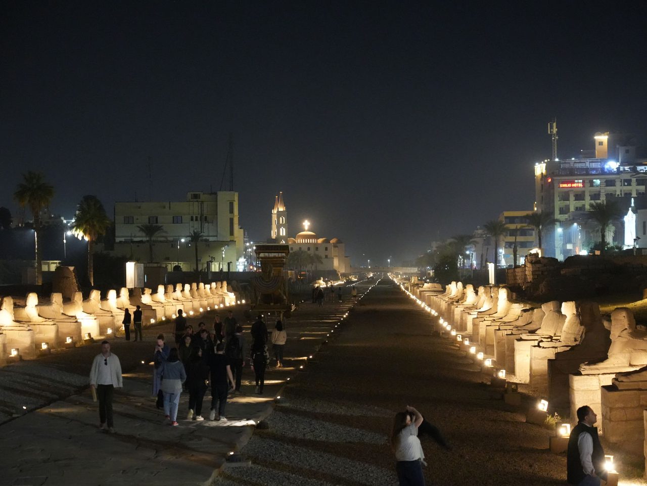 The illuminated Avenue of Sphinxes at night connecting to Luxor Temple