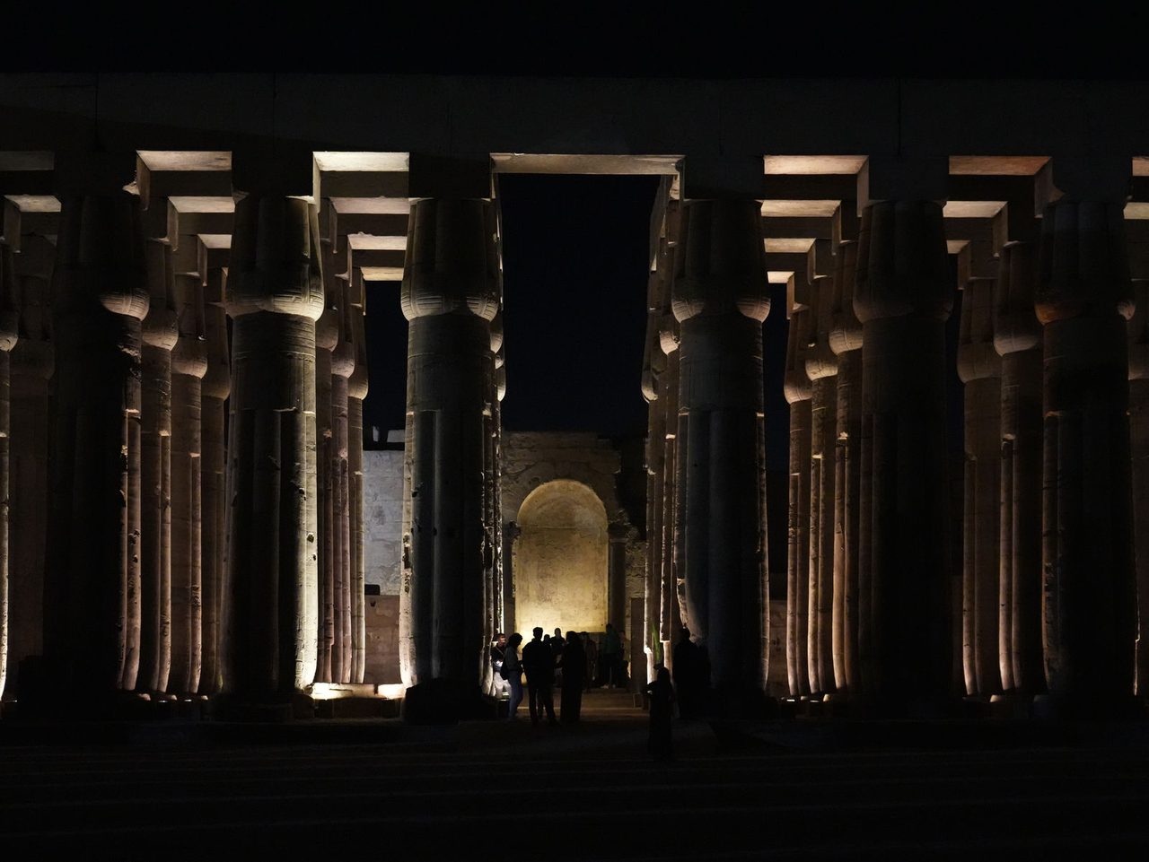 The illuminated court of Amenhotep III and the hypostyle hall at night in Luxor Temple