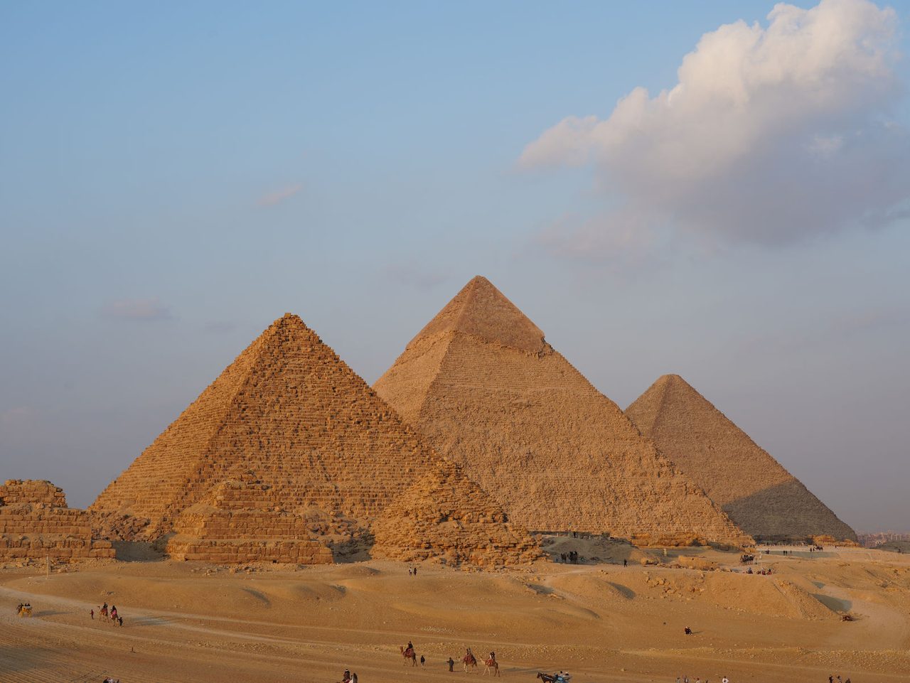 The breathtaking alignment of the Three Pyramids of Giza under the evening sun