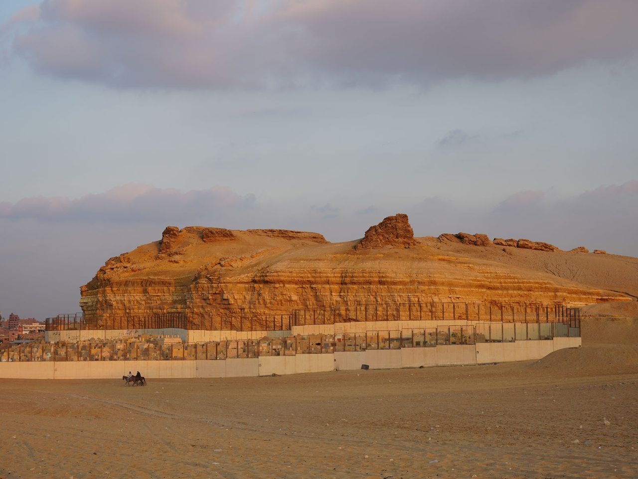 The golden glow of sunset over the rugged cliffs of Gebel Qibli