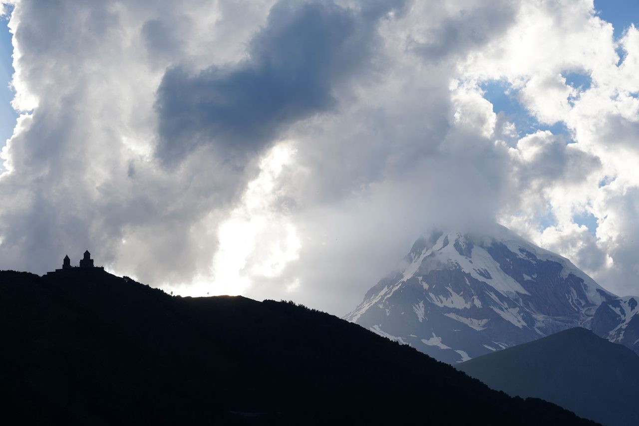 Mount Kazbek and the silhouette of Gergeti Trinity Church