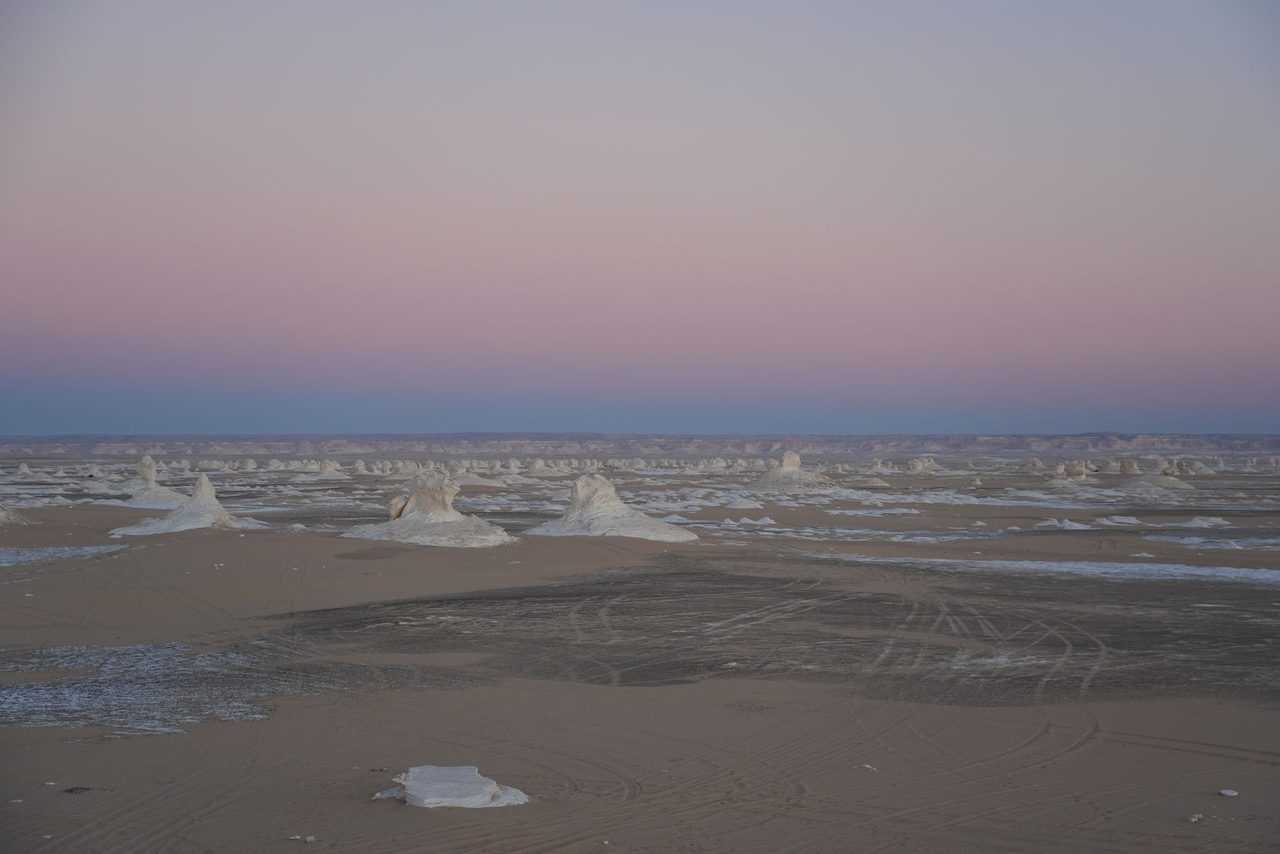 Pastel pink skies fading over the surreal White Desert