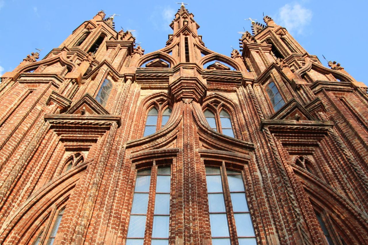 The intricate red-brick facade of the Gothic Church of St Anne