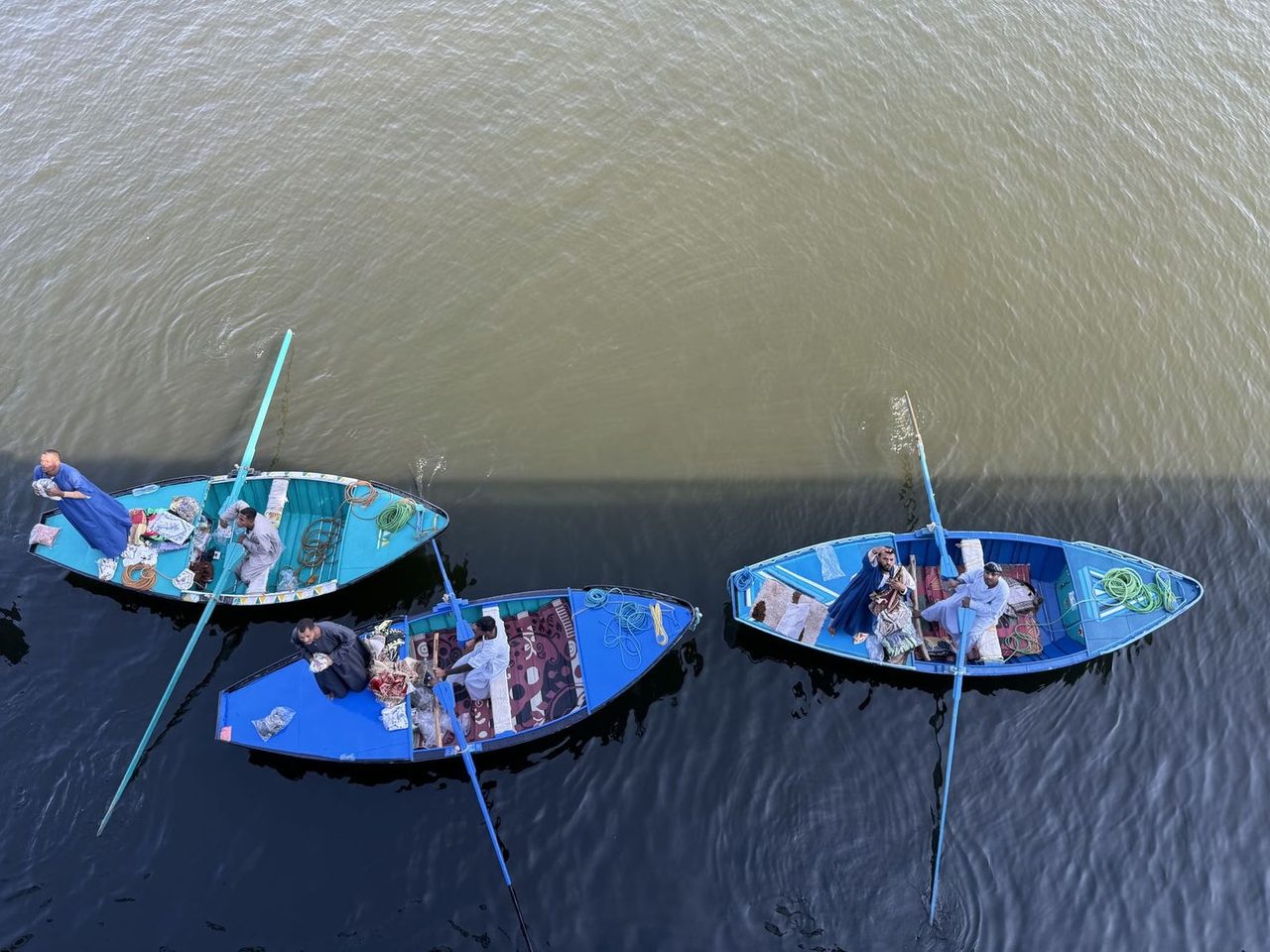 Looking down at colorful merchant boats trading along the Nile River