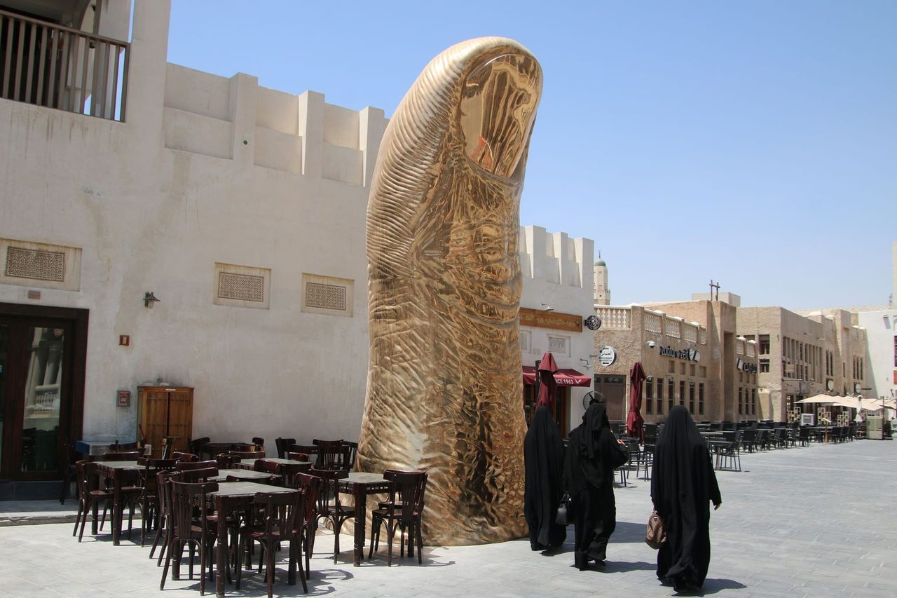 The Golden Thumb Statue at Souq Waqif