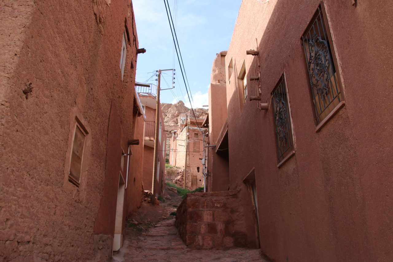 The narrow red-mud alleys of historic
