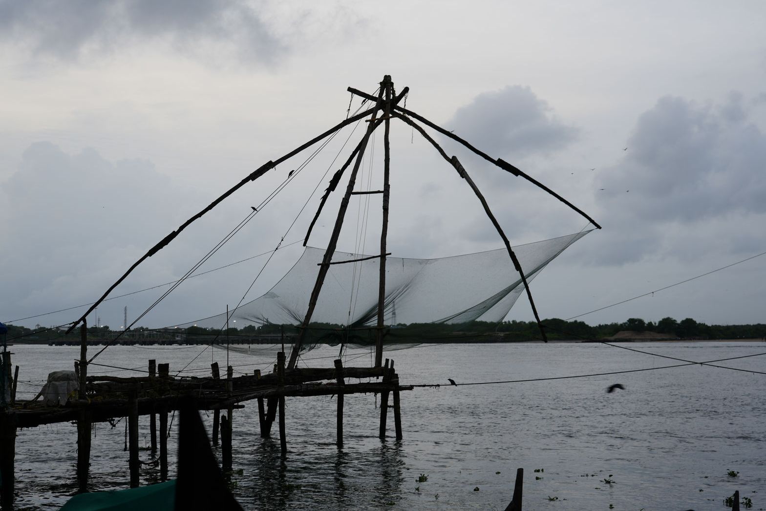 Chinese Fishing Nets under a cloudy sky