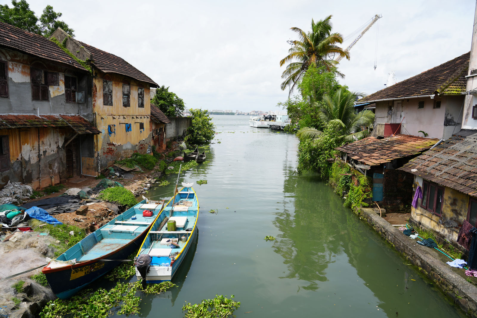 A canal view with boats and old houses