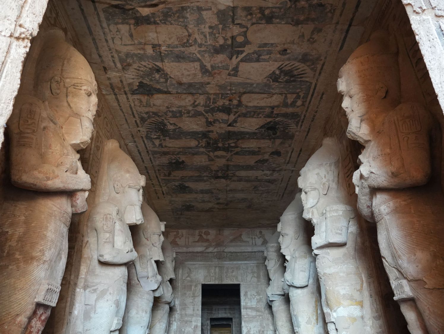 The mystical Osiride pillars guarding the sacred hall inside the Great Temple of Abu Simbel
