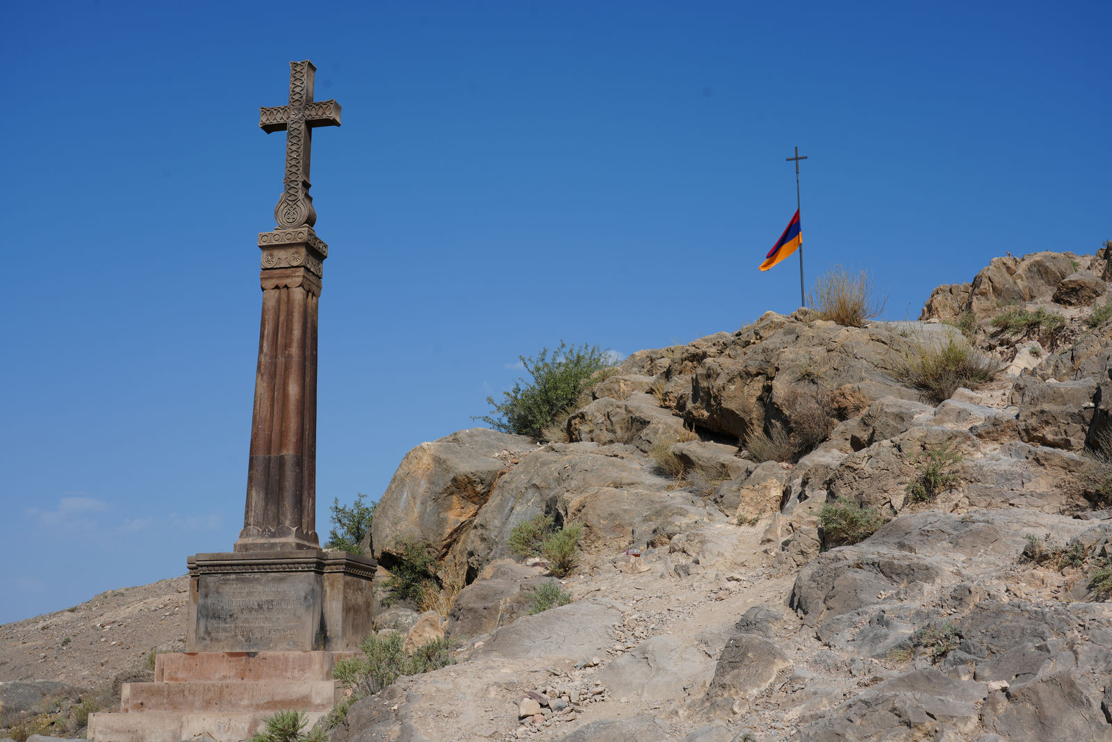 Armenian Khachkar and the national flag at Khor Virap