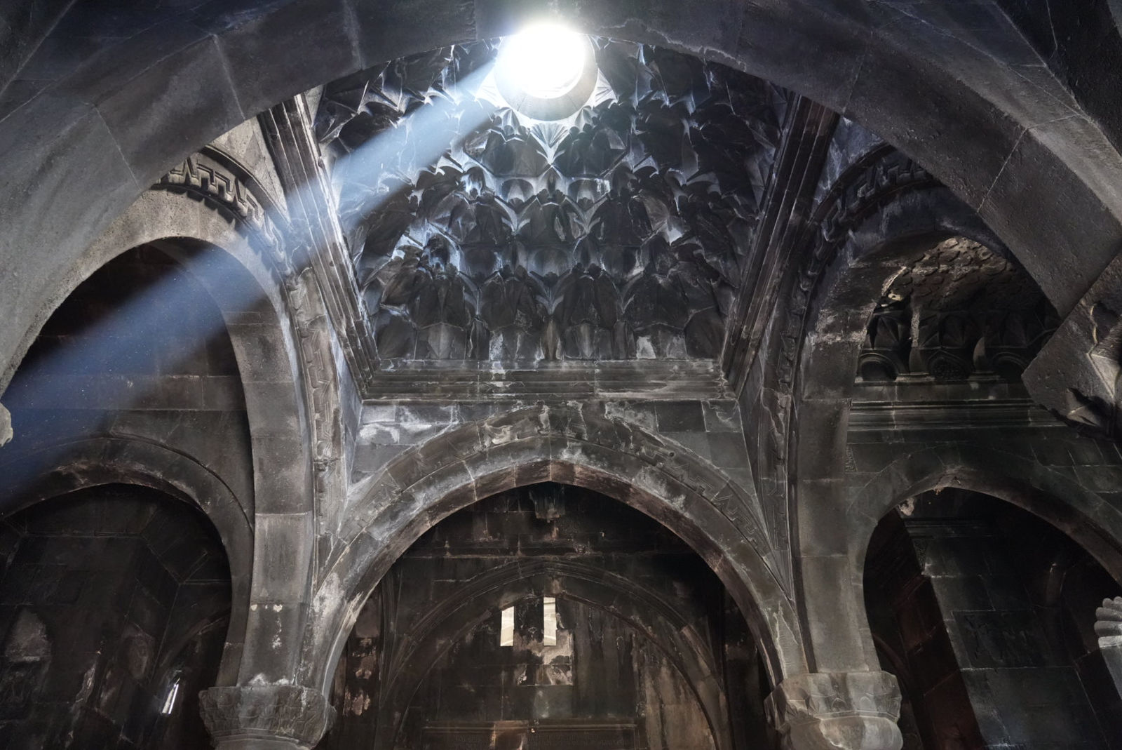 A heavenly beam of light through the dome of Geghard Monastery