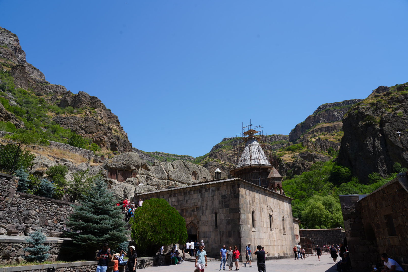 Geghard Monastery surrounded by dramatic cliffs