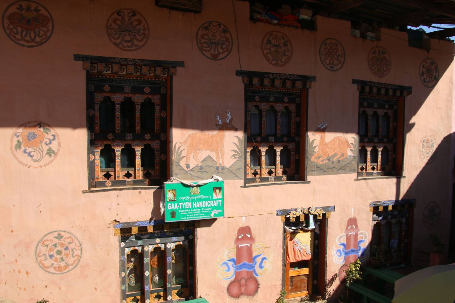 Traditional phallus murals on a building in Sopsokha village