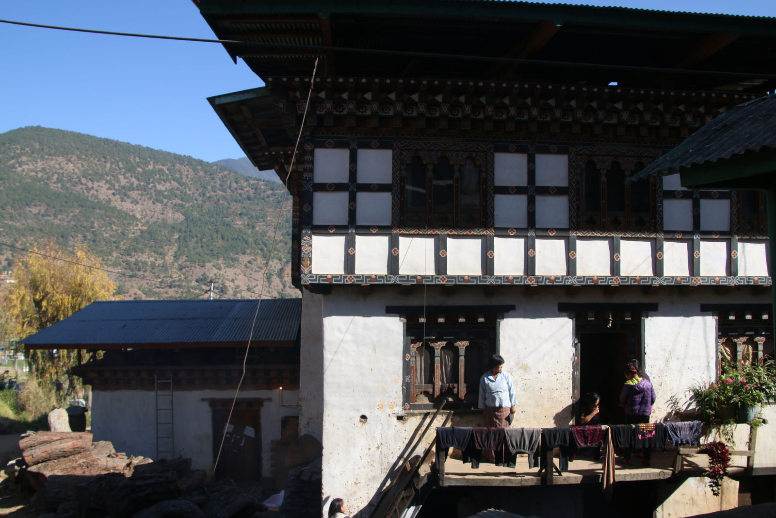 A traditional Bhutanese farmhouse in a rural village