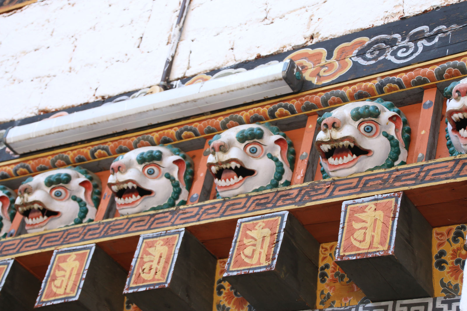 Traditional snow lion carvings at Punakha Dzong