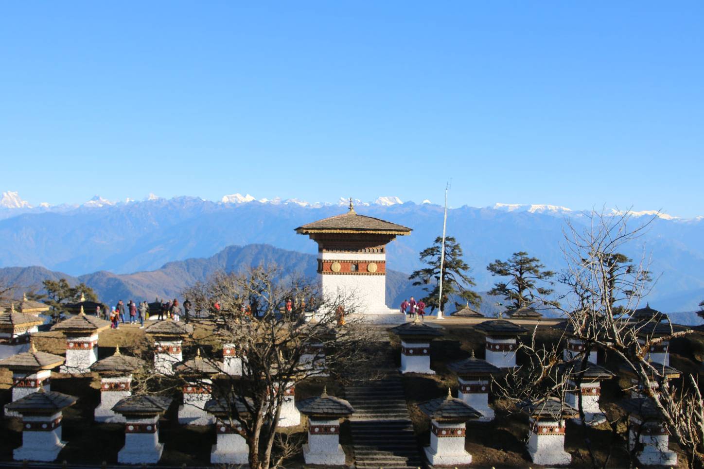 The 108 chortens at Dochula Pass with the Himalayas in the background