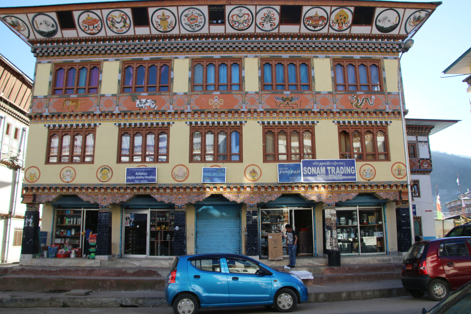 A traditional Bhutanese building adorned with intricate wood carvings and paintings