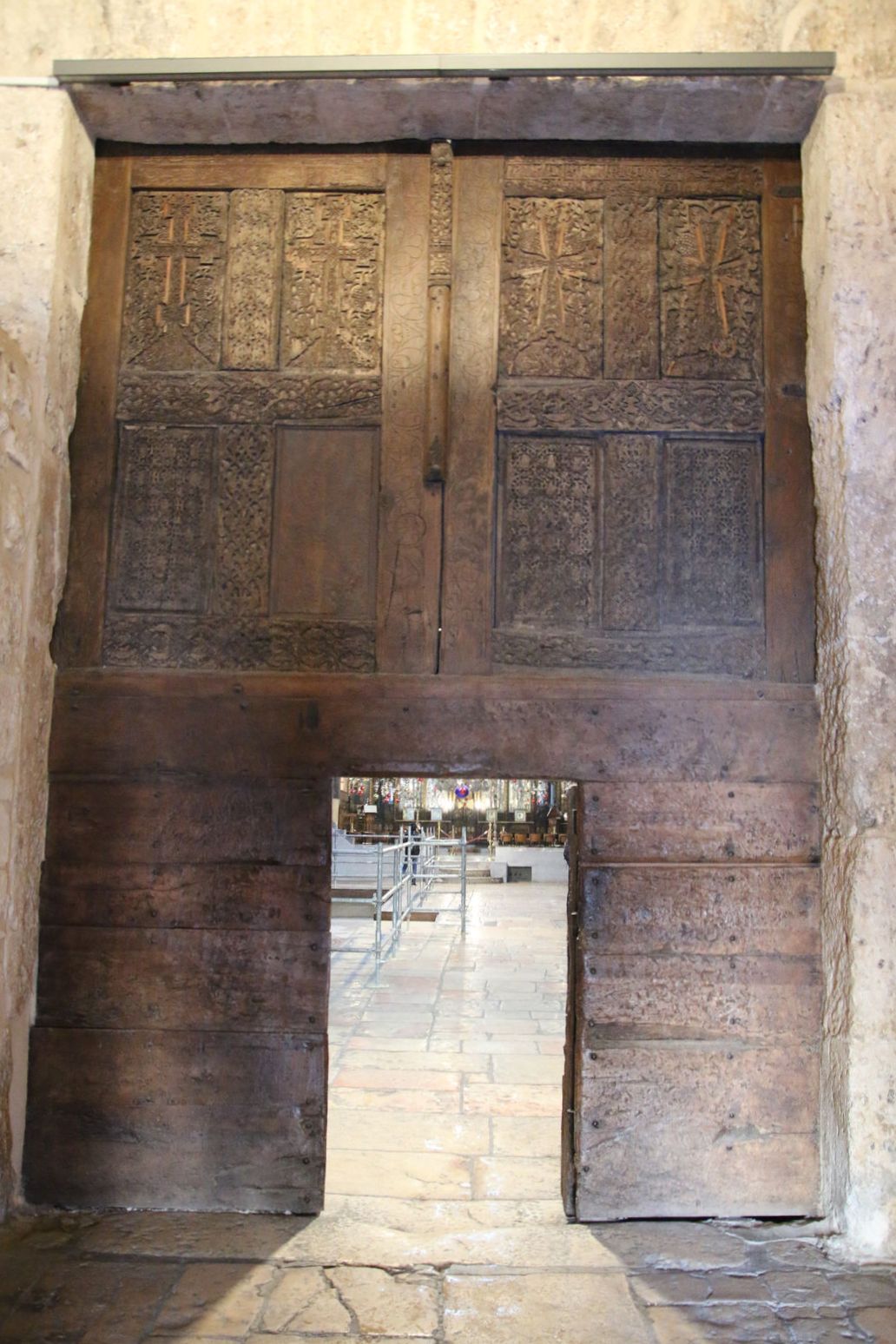The historic wooden doors inside the Church of the Nativity