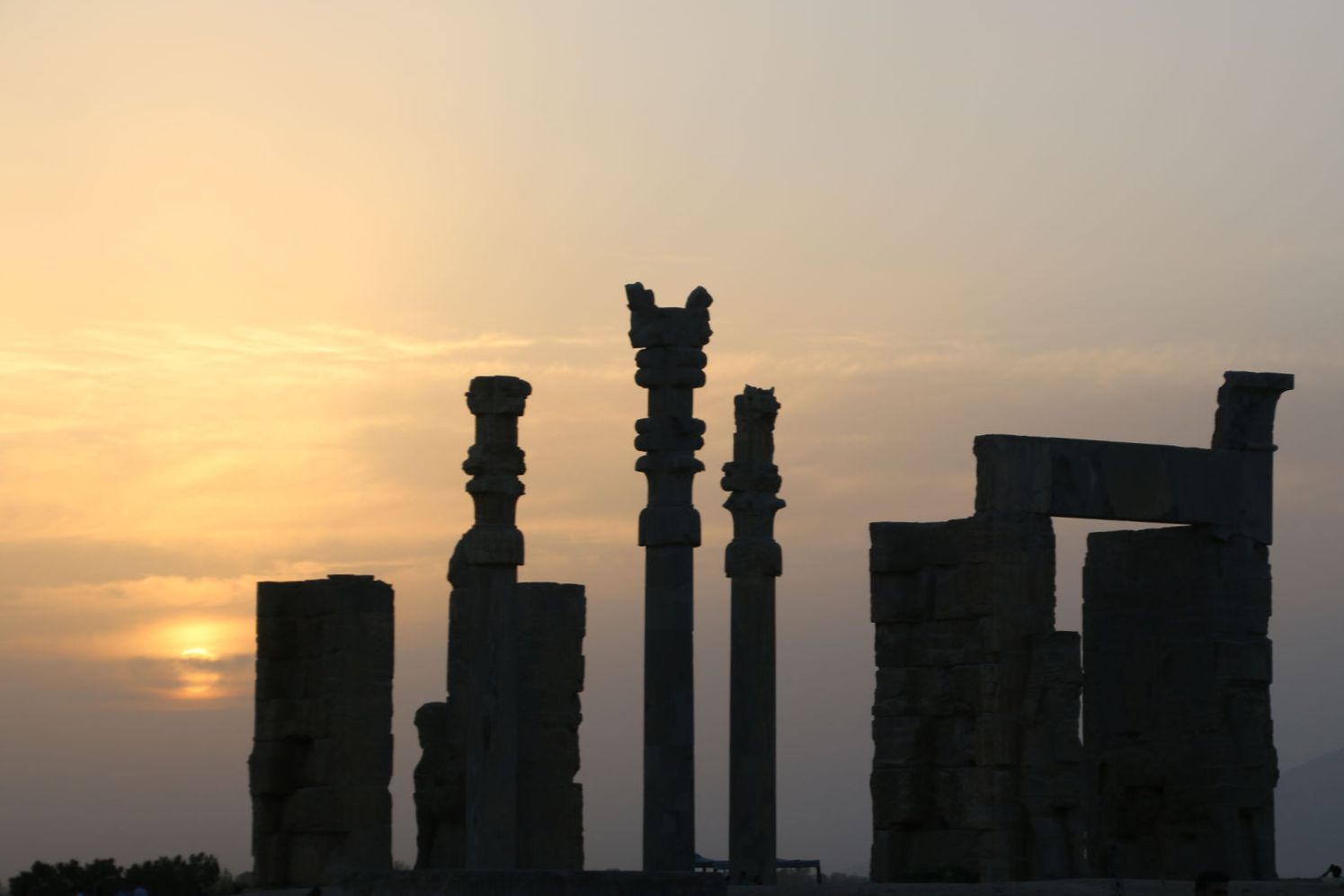 The silhouette of the Gate of All Nations at sunset