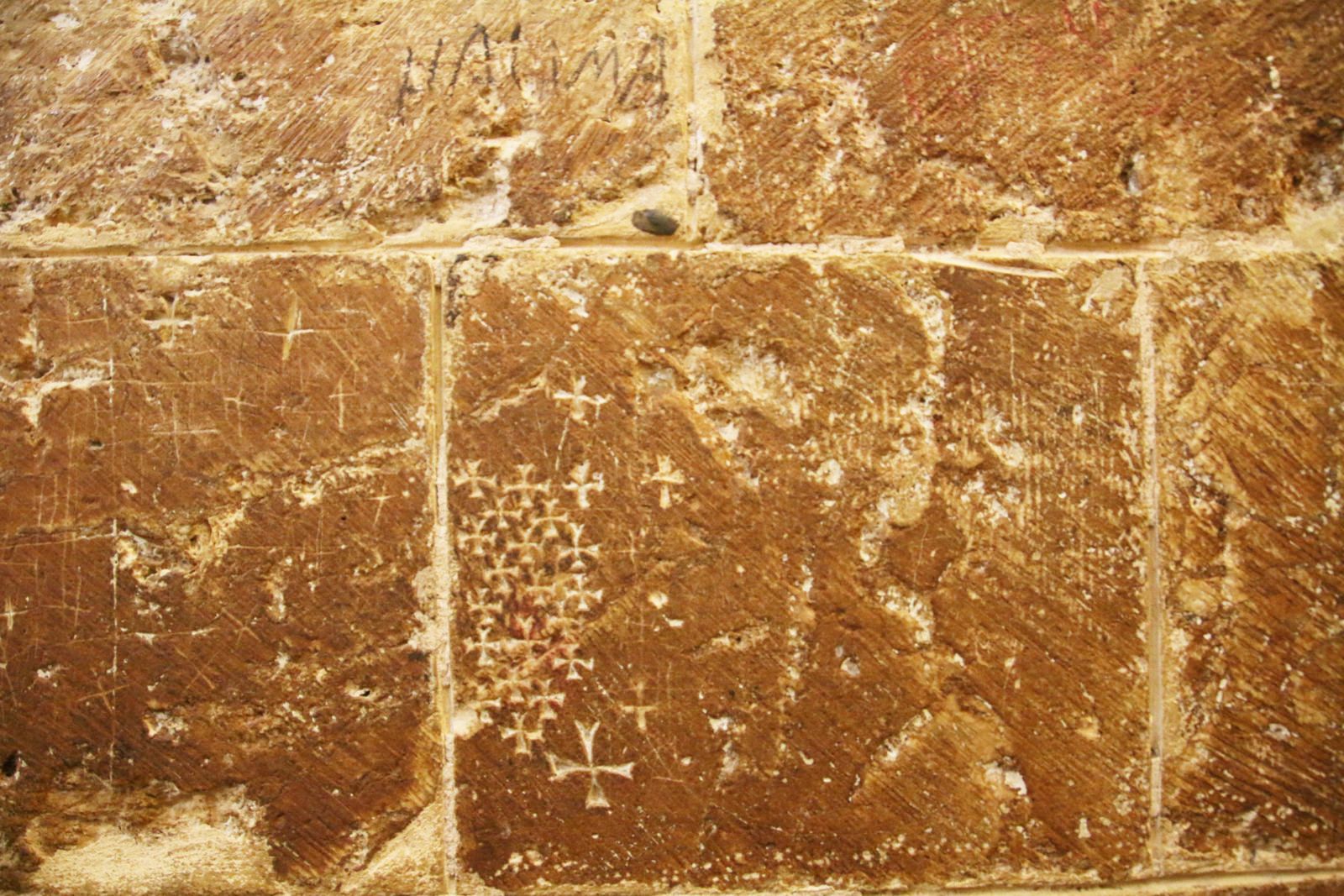 Ancient Crusader crosses carved into the walls of the Church of the Holy Sepulchre