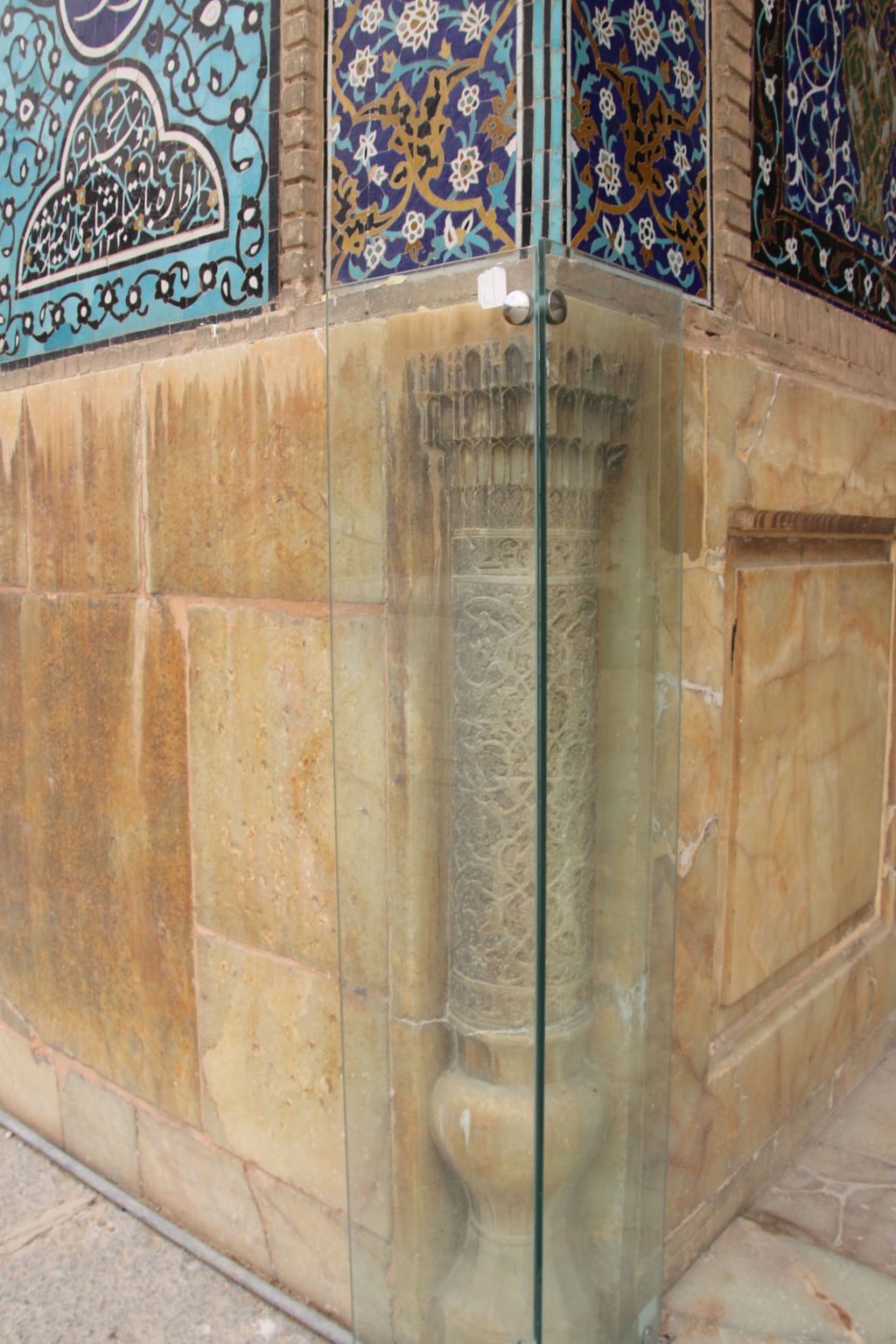 The historic marble pillar and tilework at Shah Mosque