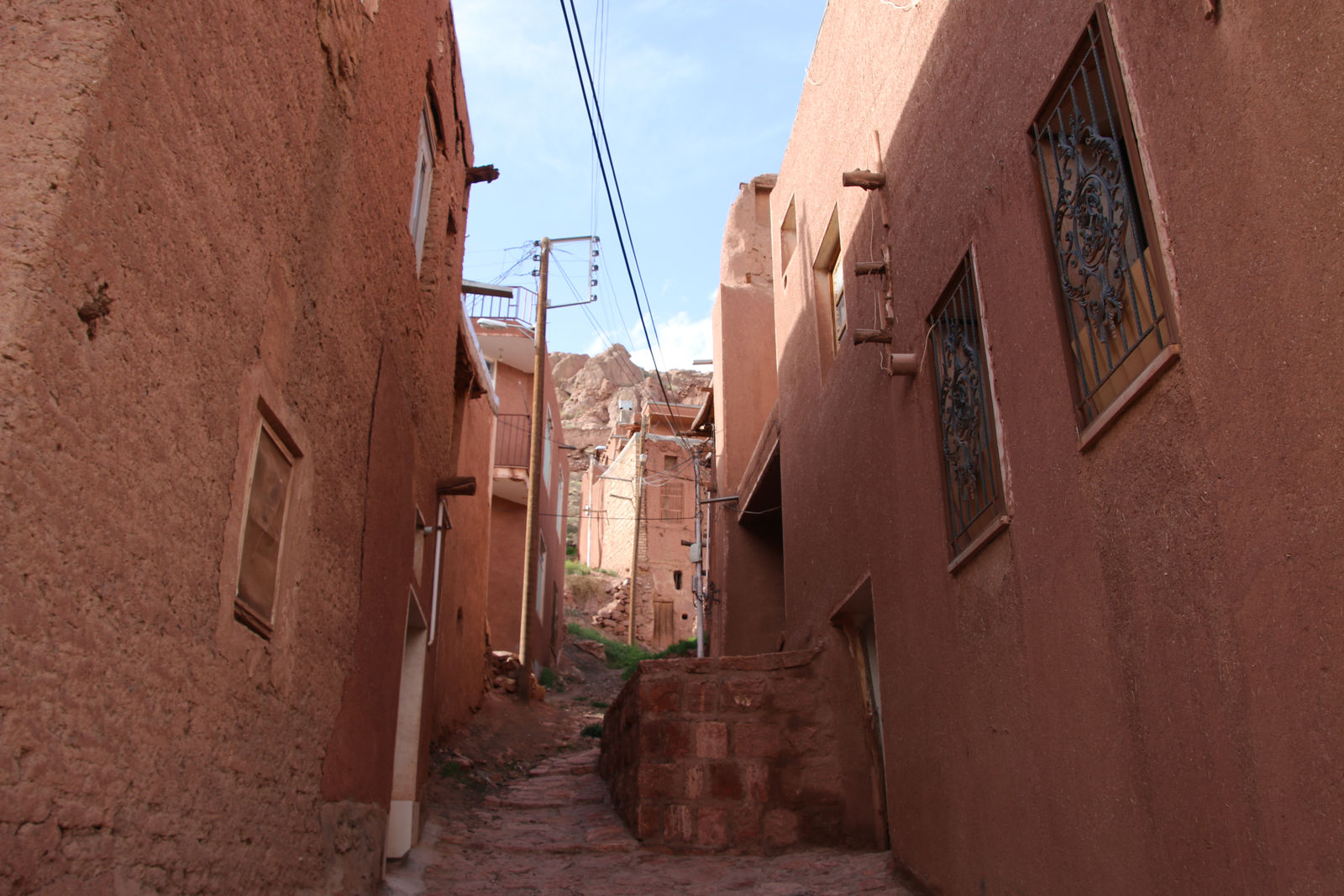 The narrow red-mud alleys of historic
